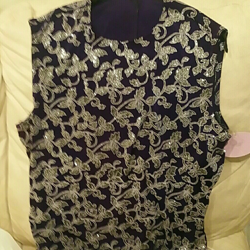 Brand new sleeveless silver glitter evening shell.